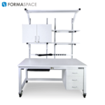 All equipped white workbench with upper and lower cabinets, power strip and two extra shelves on top.