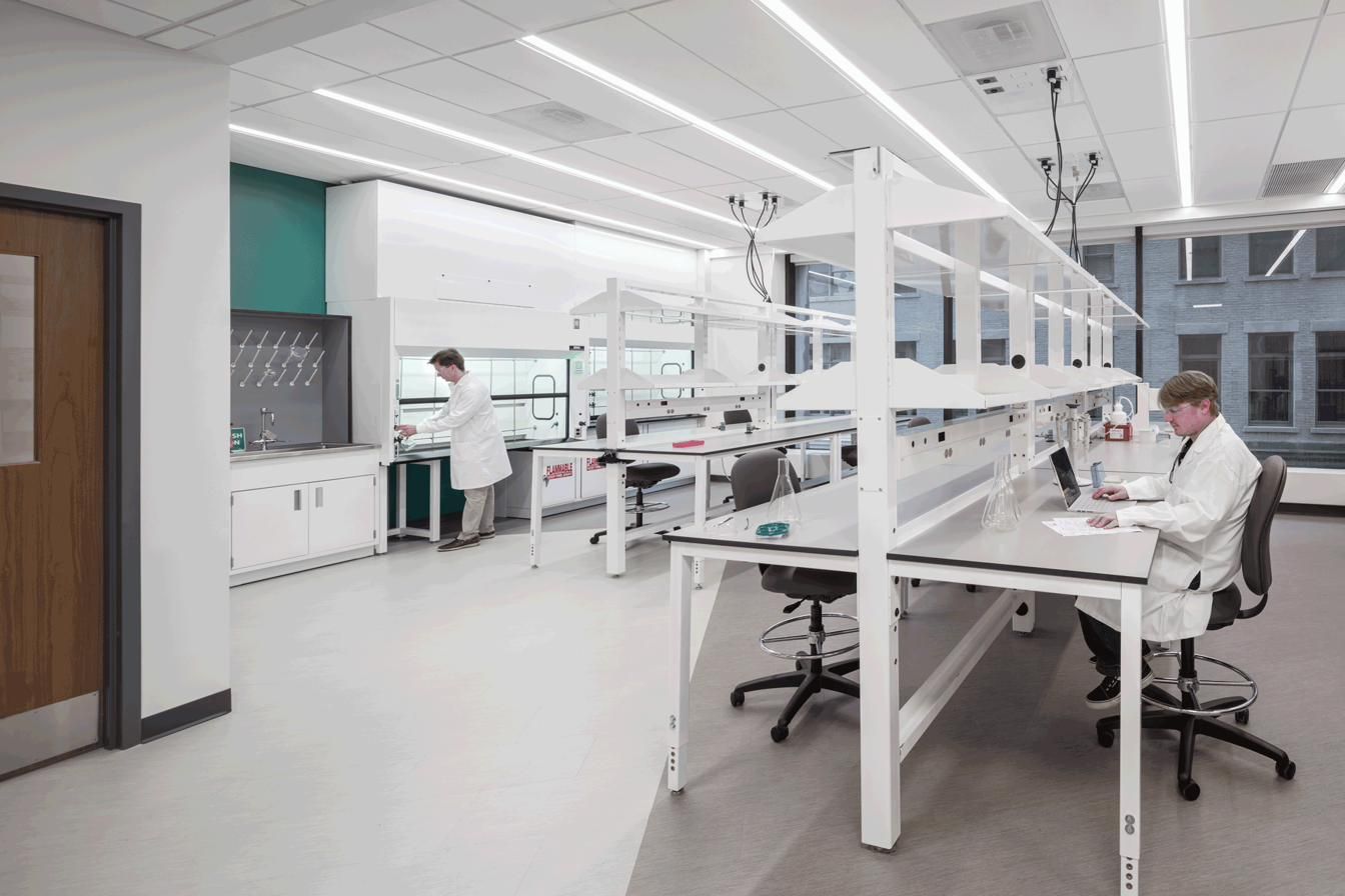Formaspace lab fitted with modular FLX workbenches and fume hood